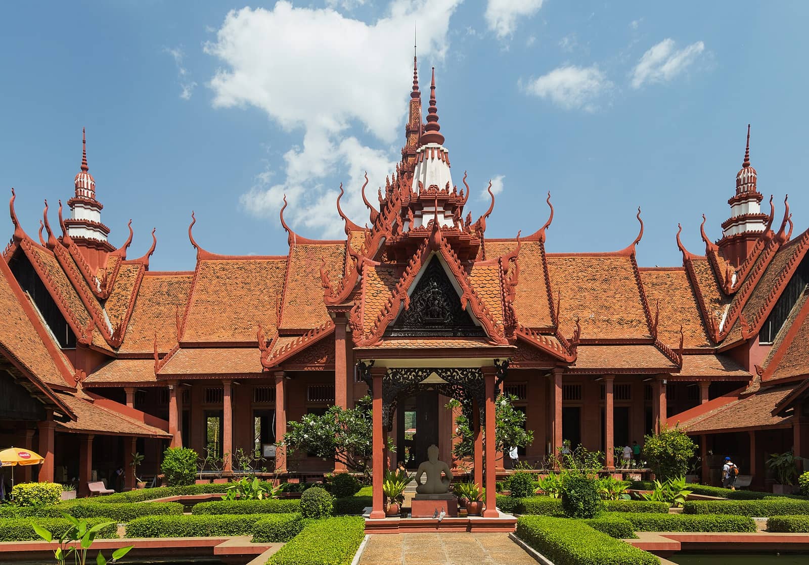 The terracotta pavilions and upswept roofs of the National Museum of Cambodia around its garden courtyard