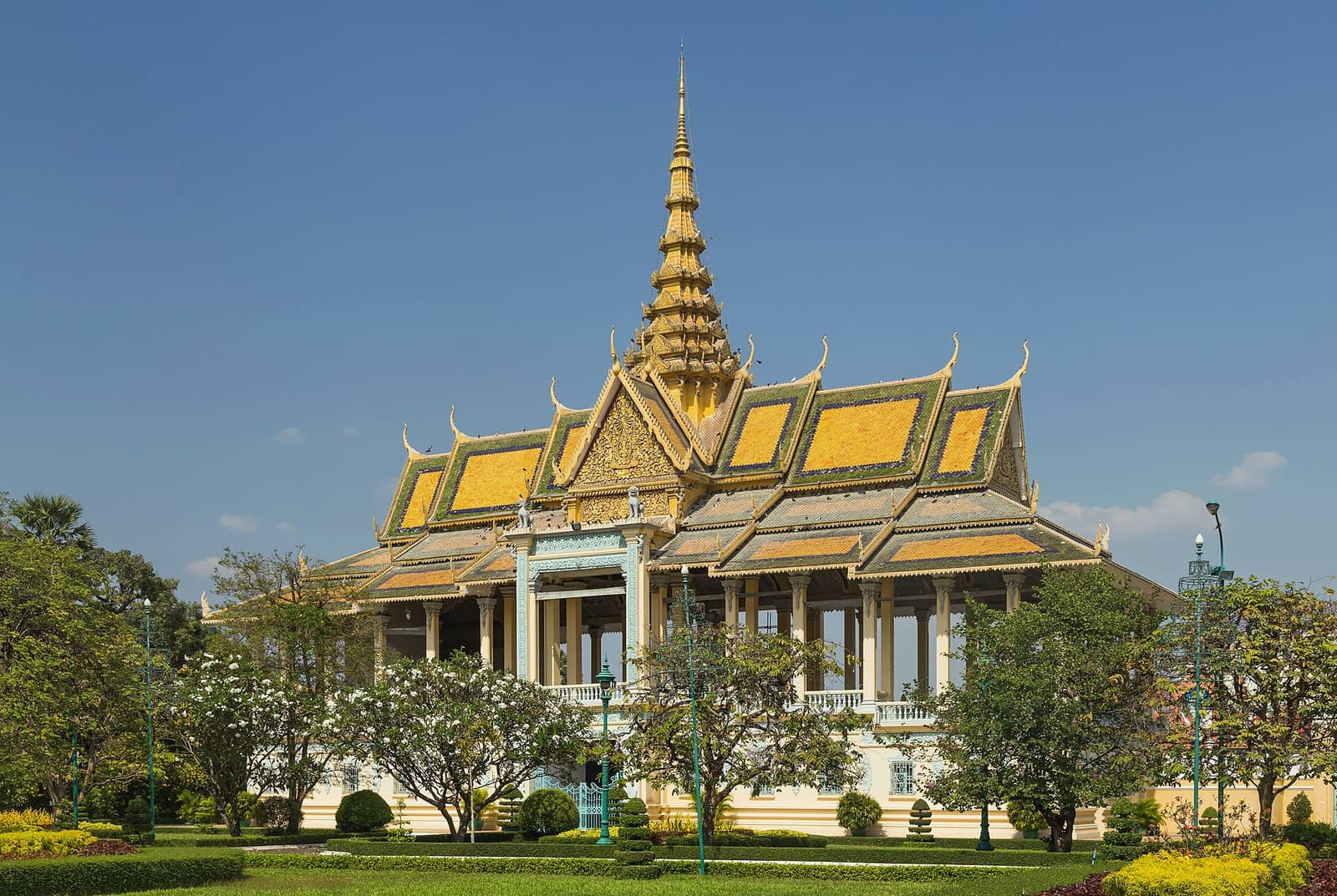 The Chanchhaya Pavilion at the Royal Palace in Phnom Penh, its gilded tiered roof and spire above clipped gardens